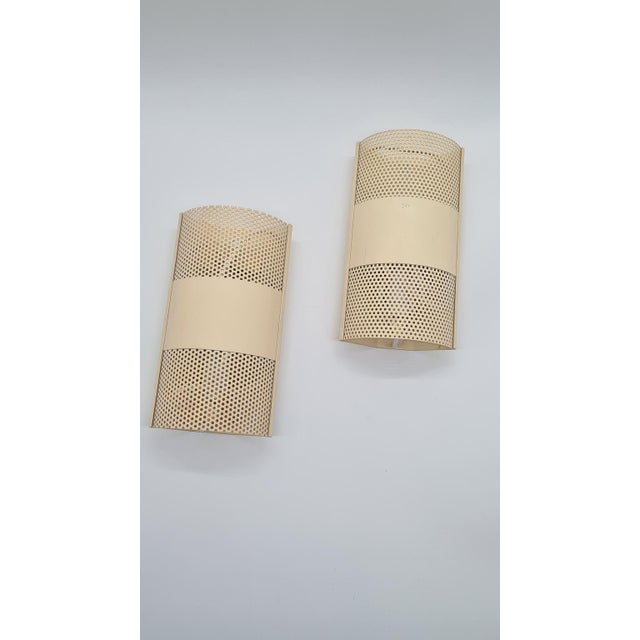 A pair of Model 319640 wall lamps, manufactured by the Danish brand David-GL Belysning in the 1970s, stands out with its...