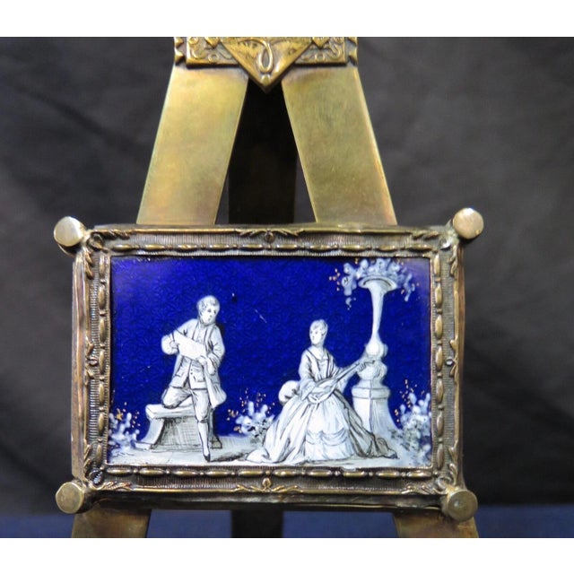 This vintage late 19th century Continental curio item is designed in brass with an enamel painting. The decorative brass...