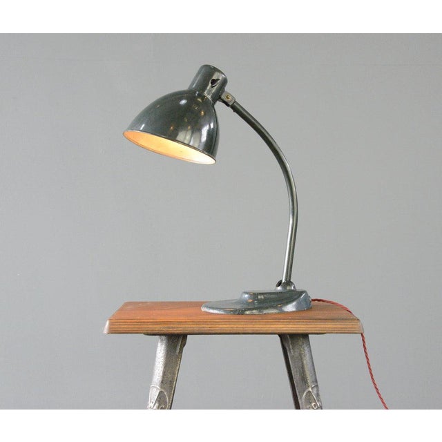 Cast iron base - Original dark green paint - Angled steel shade - Articulated arm and shade - On/off toggle switch on the...