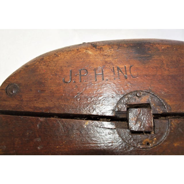 An antique Industrial design large scale pulley and hook. Possibly a great chandelier commercial or residential. Has been...