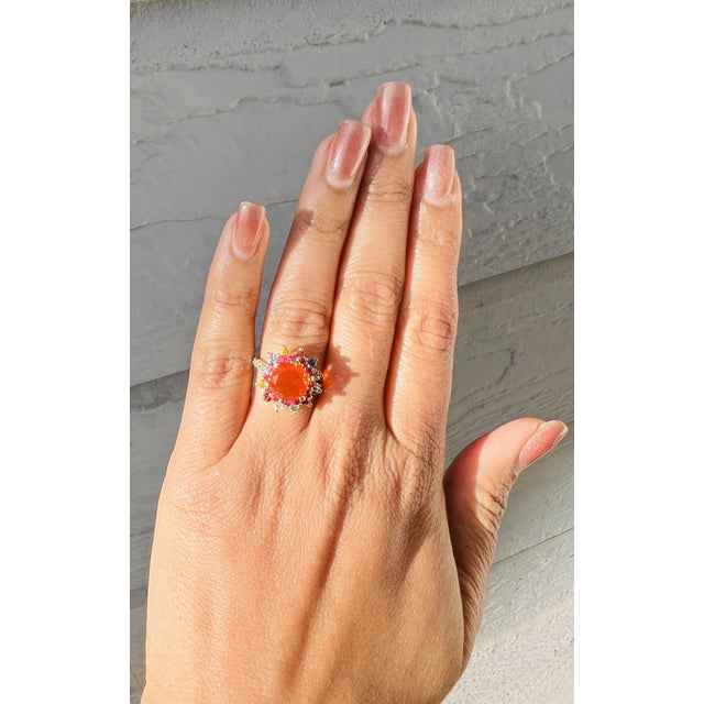 2.94 Carat Fire Opal Sapphire Diamond 14 Karat Yellow Gold Ring This Ring features a Round Cut Fire Opal weighing 1.50...