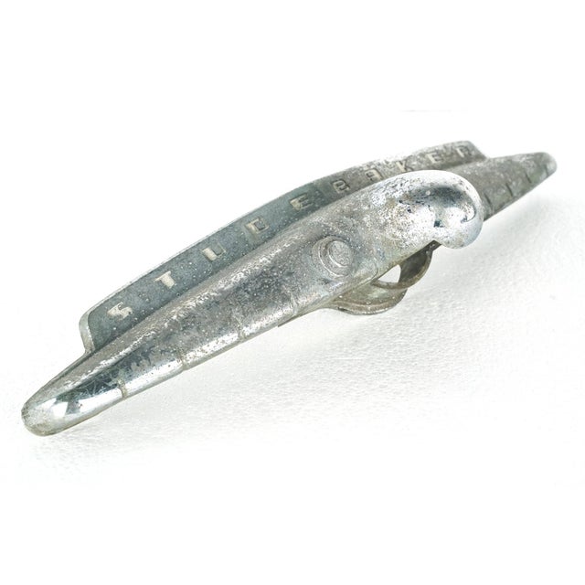 Vintage Studebaker trunk handle made of aluminum. This specific wing shaped chrome assembly was used across the 1952...
