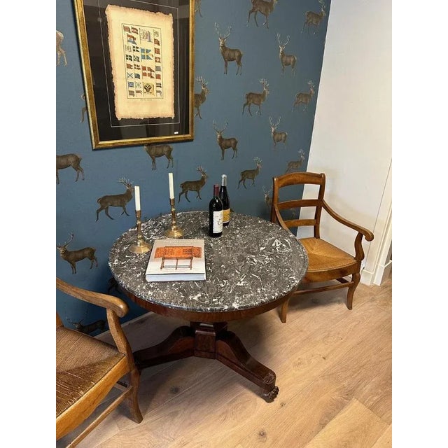 Beautiful round antique French table with beautiful marble top. Completely in good and original condition. The marble top...
