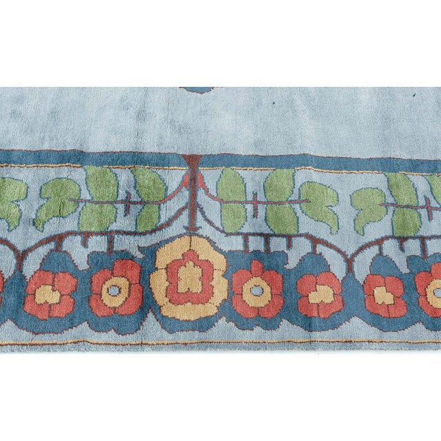 This Modern Arts and Crafts Style Rug presents a captivating fusion of tradition and contemporary charm. The field is a...