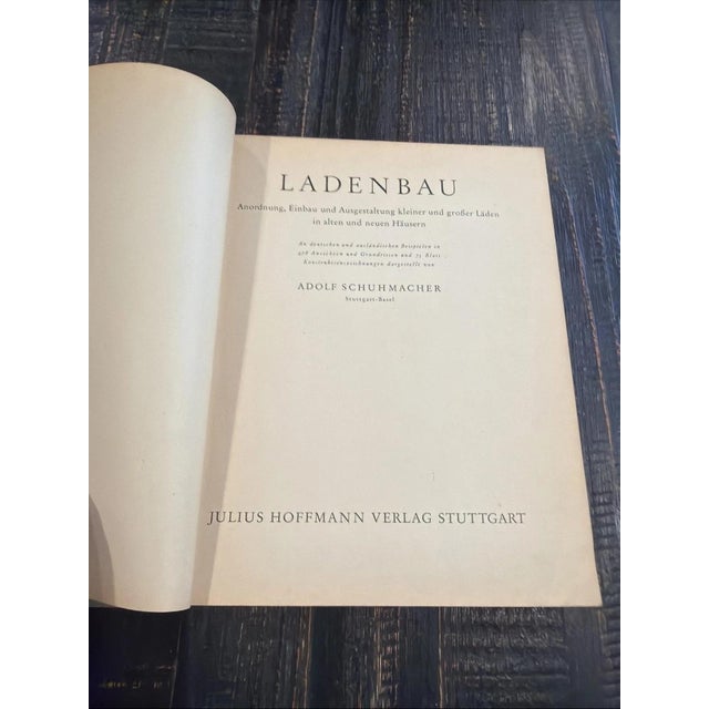Vintage first edition copy (with dust jacket) of the softcover German language book entitled Ladenbauer (translated as...