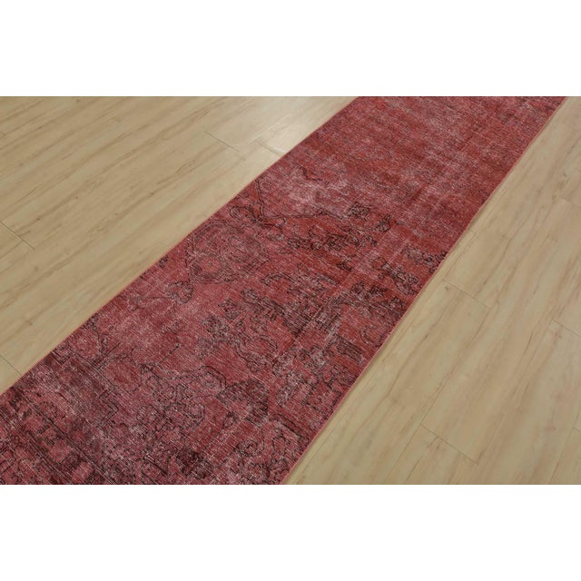 An authentic vintage traditional overdyed Tabriz runner hand-knotted with fine wool and natural dyes. This oriental rug...