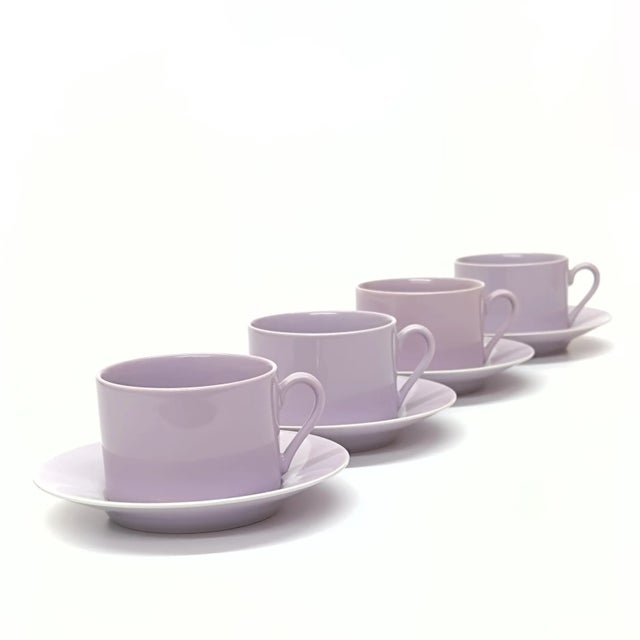 Lilac cups and saucers, group of 8. This group of lilac perma-glaze cups and saucers are a timeless modern classic,...