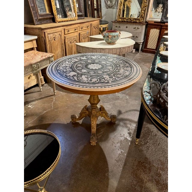 Rare 19th century Italian carved and giltwood center table with incredible Scagliola marble top. Circa 1850. A fine...