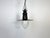 Industrial black enamel pendant light made in German during the 1930s. White enamel inside the shade. Clear glass cover....