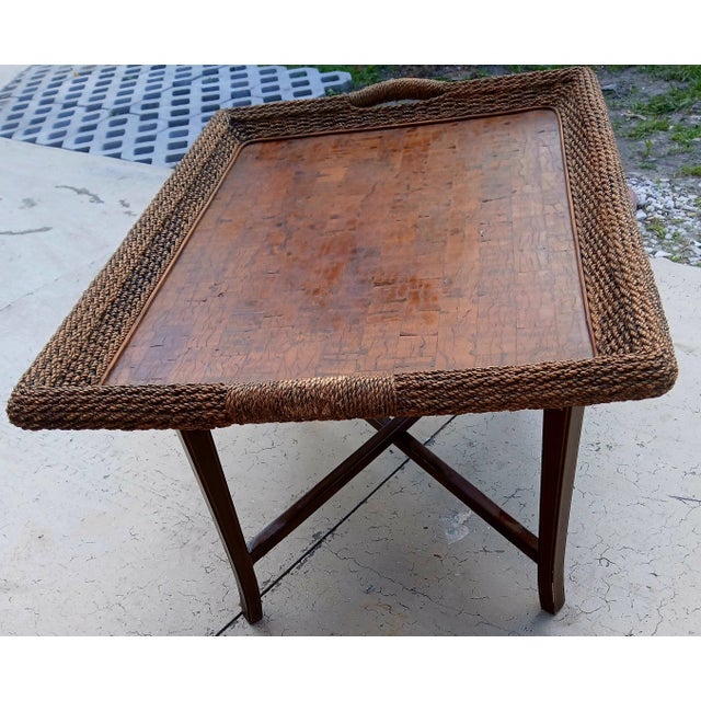 Vintage seagrass and koa wood veneer tray table or butler table. Very large for thevtype - 45 inches long, 24 high, and 31...