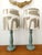 Pair of vintage lamps in sage green painted wood. Custom-made cylindrical lampshades upholstered in a modernist abstract...