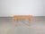 We are offering an authentic vintage pecan wood coffee table for sale. The design is reminiscent of Johannes Andersen's...