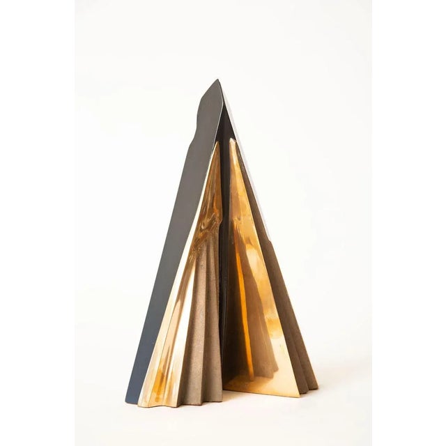This fabulous abstract vintage Italian bronze and black stained wood sculpture looks like pleated bronze that is both...