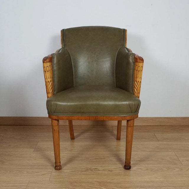 A superb art deco armchair by maurice adams. Burr walnut and figured walnut veneered with solid walnut carved detail to...