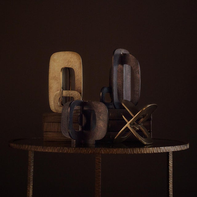 A study in positive and negative form, the Tall Modernist Sculpture is defined by sculptural contrast and hand-cast depth....