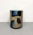 A striking vintage Postmodern side table handcrafted in Colombia by JIMECO Ltda., featuring a clean cylindrical silhouette...