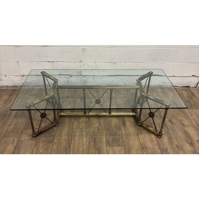 This is a stunning vintage Maison Jansen-style Hollywood Regency style brass and glass rectangular coffee table or...