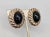 1980s oval goldtone with oval cabochon faux-onyx with ribbed edging clip earrings. Marked "PANETTA" on the clips and on...