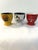 Cute set of five ceramic egg cups each in a different Parisian motif. Marked underside "NEM." Great condition.