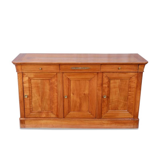 Sideboard / Chest of Drawers, France, ca. 1835, cherry wood, three doors, three drawers, restored and hand-polished with...