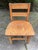 A solid oak wood child's chair . Well constructed and sturdy.