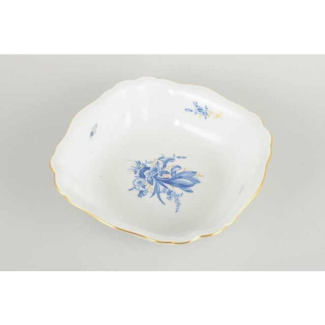 Meissen Square bowl with softly scalloped sides. Hand-decorated porcelain with hand-painted blue floral motifs in classic...