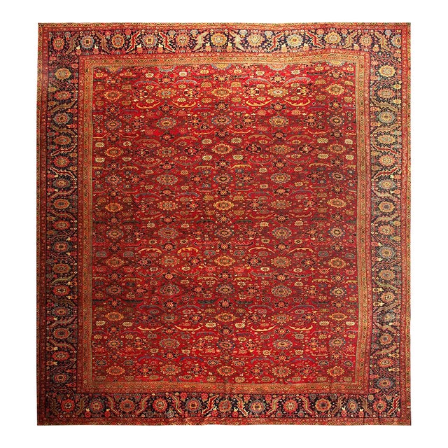 1890s Antique Red Ground Overscale Botanical Knotted Wool Persian Sultanabad Rug For Sale