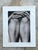 This vintage signed photographic art print presents a captivating study of the human form through an intimate black-and-...