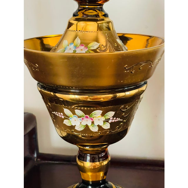 Large antique Bohemian cut amber glass with gold and enamel compote on stem foot with cover.