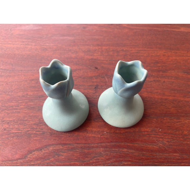 Elevate your home decor with a touch of historical elegance. These Van Briggle candlesticks feature a stunning ming...