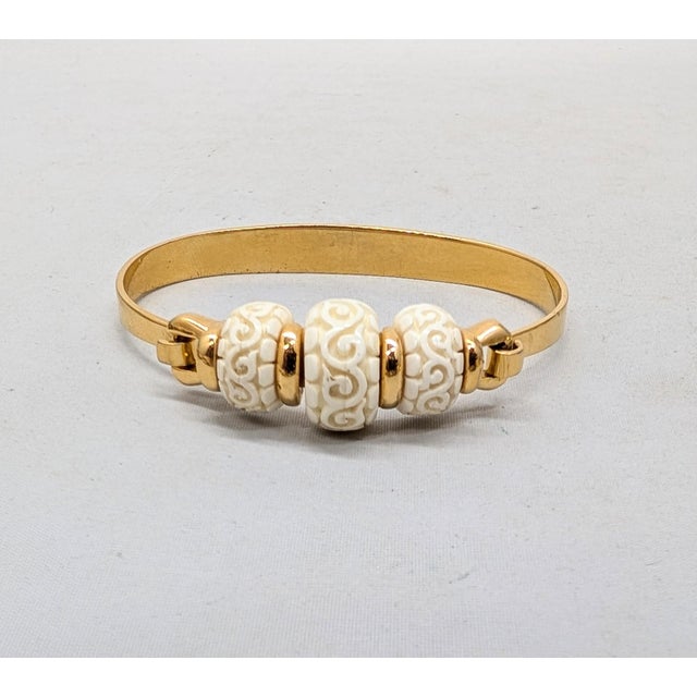 Vintage Signed Crown Trifari Goldtone Carved Faux-Ivory Cuff Bracelet For Sale In Philadelphia - Image 6 of 12