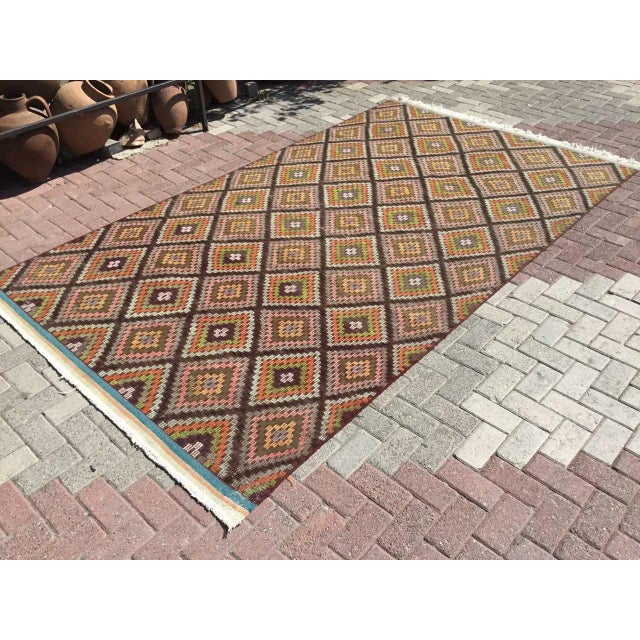 This beautiful, vintage, handwoven kilim is approximately 60 years old. It is handmade, of very fine quality hand spun...
