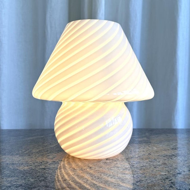 Iconic swirl Murano glass table lamps in pink cream. Mushroom shaped Murano glass table lamps are still one of the hottest...