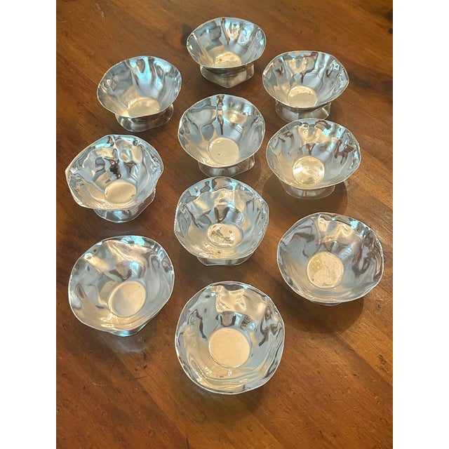 A sophisticated set of ten sculptural silverplate sorbet desert bowls by New York designer Izabel Lam. Featuring graceful...