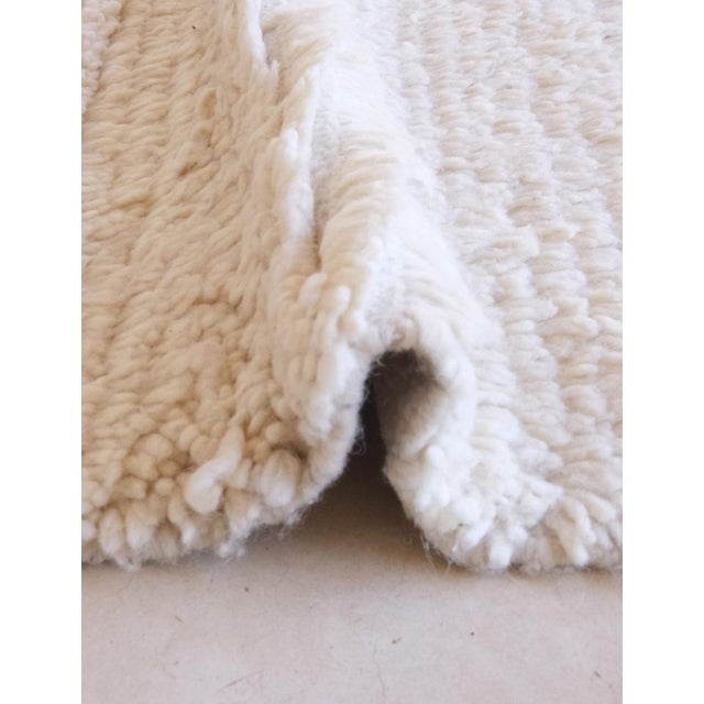 Contemporary Azilal Moroccan Rug – Minimal Abstract Wool with Graphic Accents This contemporary Azilal rug is a refined...