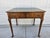 A gorgeous George III style writing desk with a tooled green leather top. This writing desk is made by Baker Furniture and...