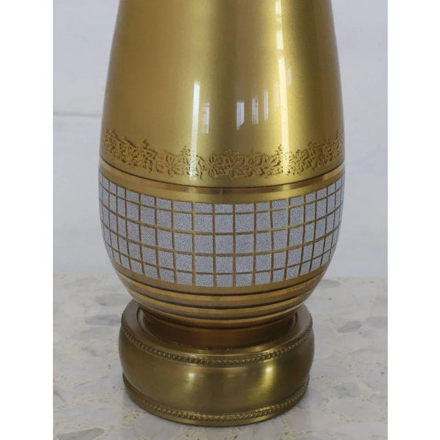 Mid-century modern gold tone glass vase shape table lamp. Made in the mid 20th century.