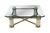 A stately Italian Regency Coffee Table, circa 1980s. Features a beveled glass top with canted corners supported by a...