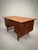 Discover this timeless 1960s Danish teak wood desk, designed with a sophisticated suspended structure supported by four...