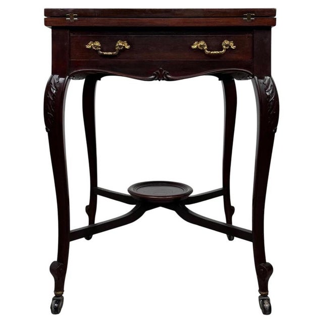 A handsome and finely crafted early 20th-century English envelope card table, beautifully constructed from mahogany and...