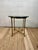 Elegant vintage Neoclassical gueridon or side table featuring a finely detailed brass frame and a substantial round...