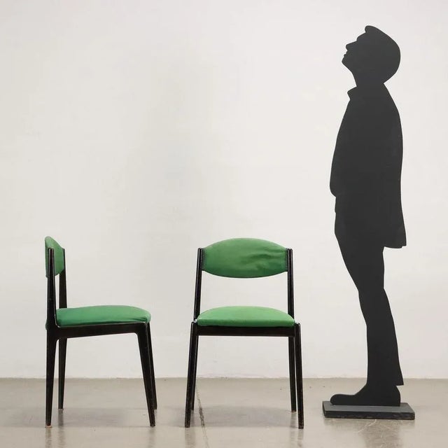 Pair of chairs, ebony dyed wood, expanded padding, fabric covering. This piece is attributed to the mentioned...