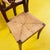 This elegant set of solid wood chairs is a charming example of vintage design. Each chair features a delicate straw weave...