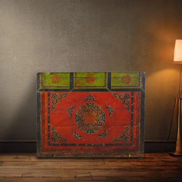 The front of this antique cabinet is decorated with hand painted flower wreath in the center surrounded by 5 bats and...