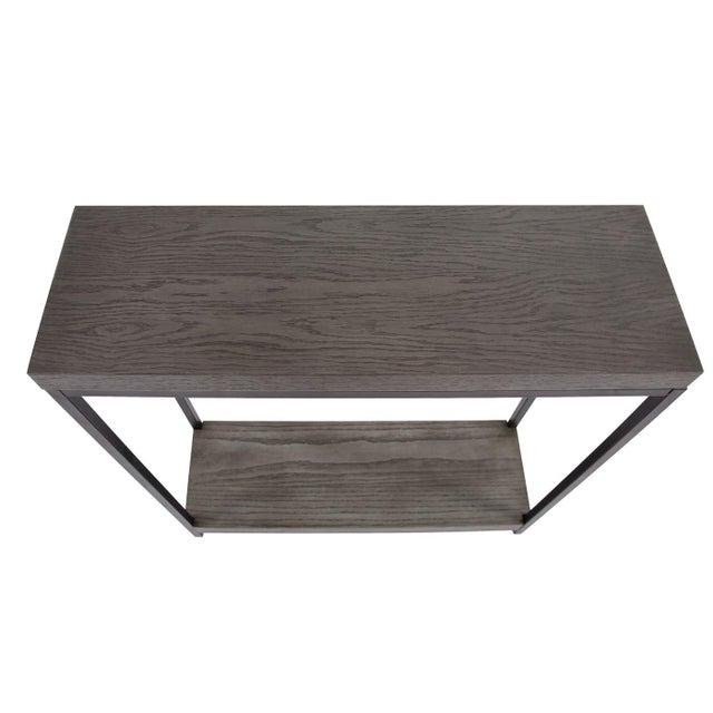 The Kenton Console Table A growing movement in design is taking furniture to a cleaner, more minimal style. A deep rich...