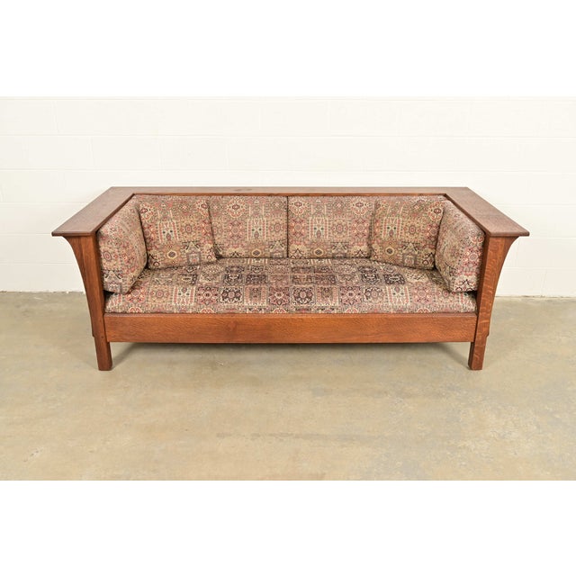A gorgeous Mission or Arts & Crafts style settle sofa By L. & J.G Stickley USA, Circa Late 20th Century Solid quarter sawn...