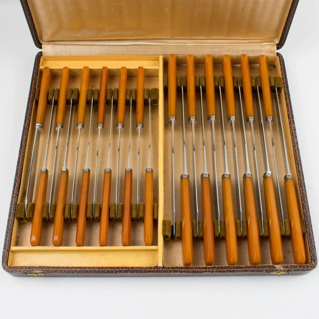 Elegant French Art Deco Bakelite and stainless steel knives set in original box. Two sets of 12 pieces each, for meat and...