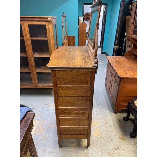 Up for sale is a Antique Tiger oak Dresser with a Swivel Mirror up top. The piece is hand carved and looks to be fully...