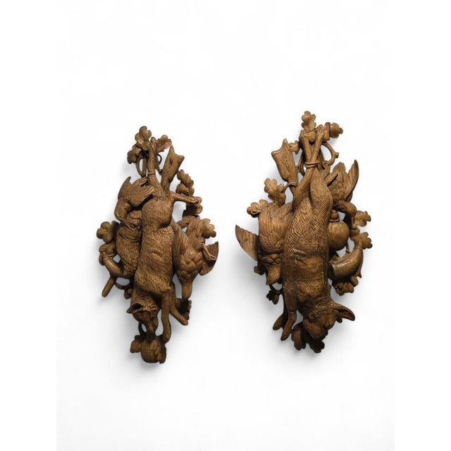 Decorative pair of carved wooden hunting trophies originating from the Black Forest region or Switzerland, executed in...