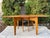 Classic mid-century modern drop leaf dining table, model M166, by Heywood-Wakefield, crafted in solid maple with the...